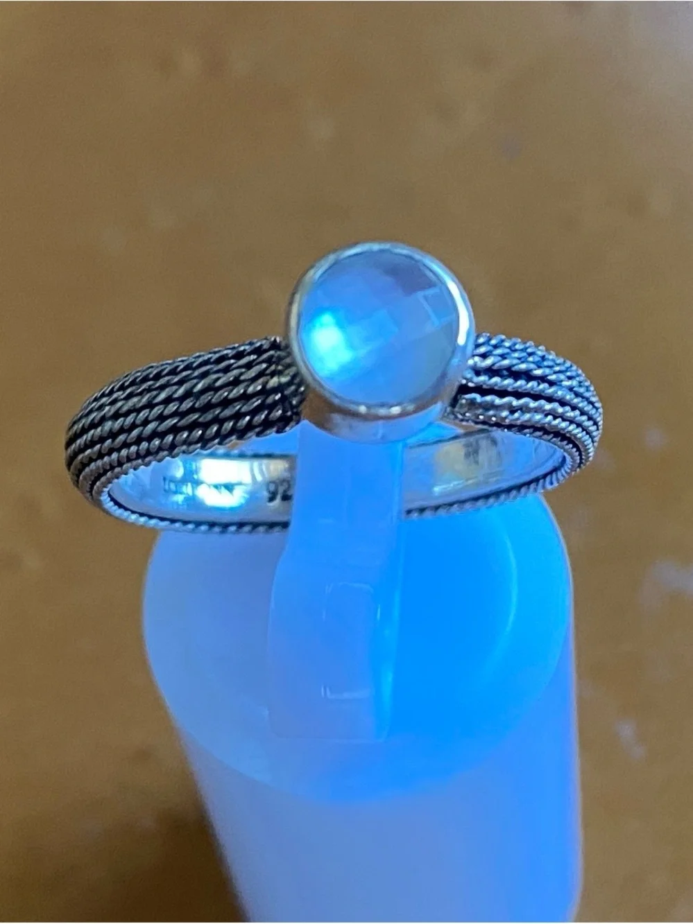 Sterling Silver Braided Band Ring with Reflective Faceted Stone